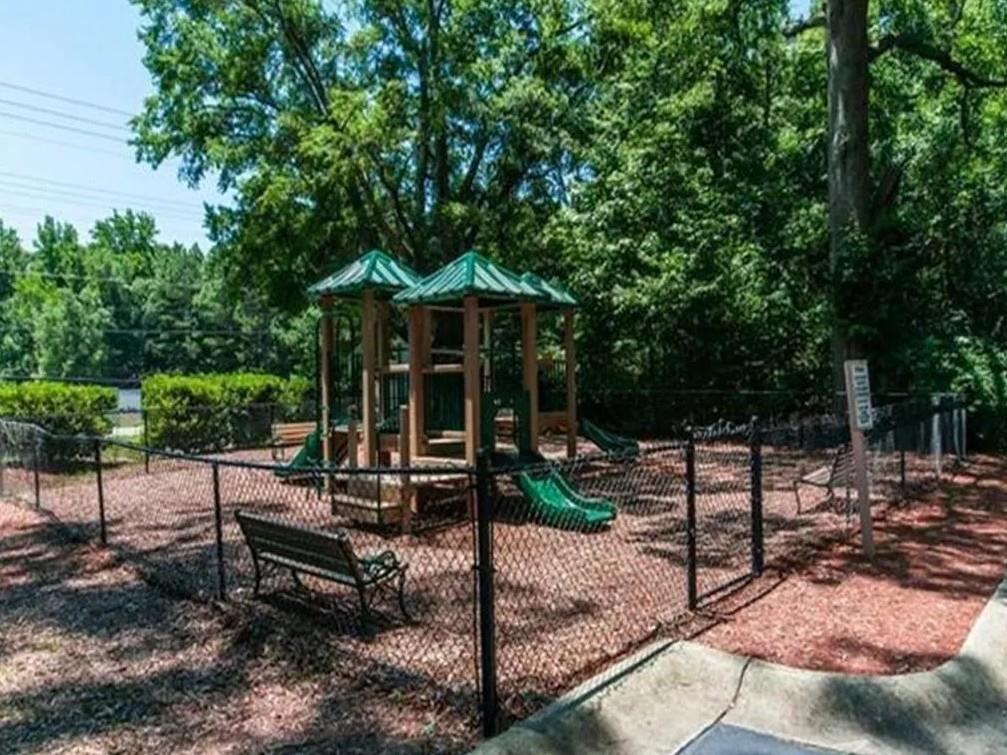 1600 Blairs Bridge Road, Unit 1701 Lithia Springs, GA 30122 - Photo 18 of 21 a view of a bench in the backyard