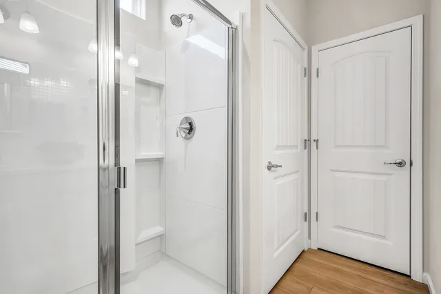 a view of a bathroom with a glass shower door