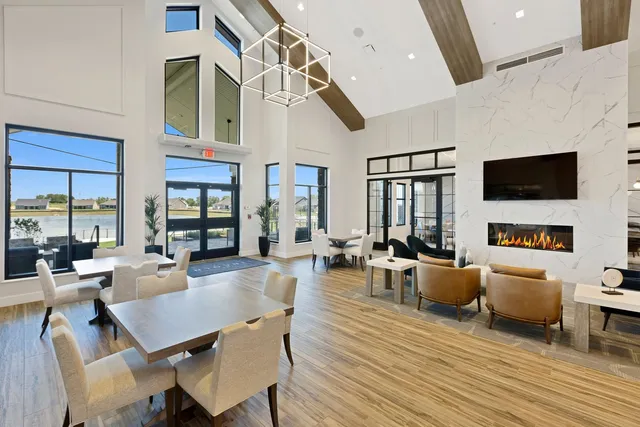 a living room with fireplace furniture and a flat screen tv