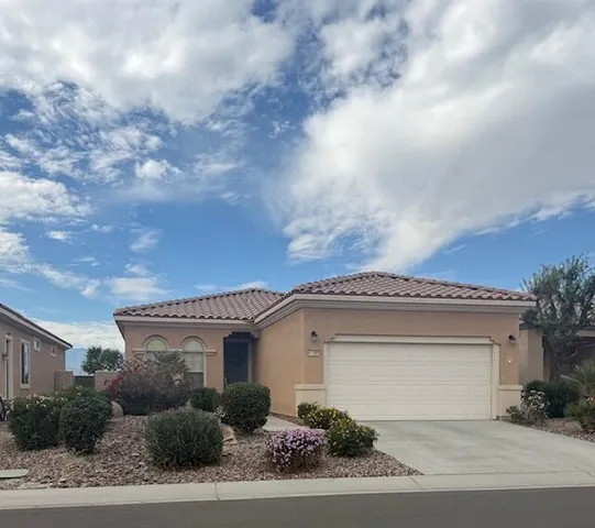 a front view of a house with a garage