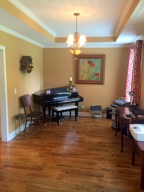 7813 Zebulon Road Macon, GA 31220 - Photo 13 of 21 a view of a dining room with furniture and chandelier