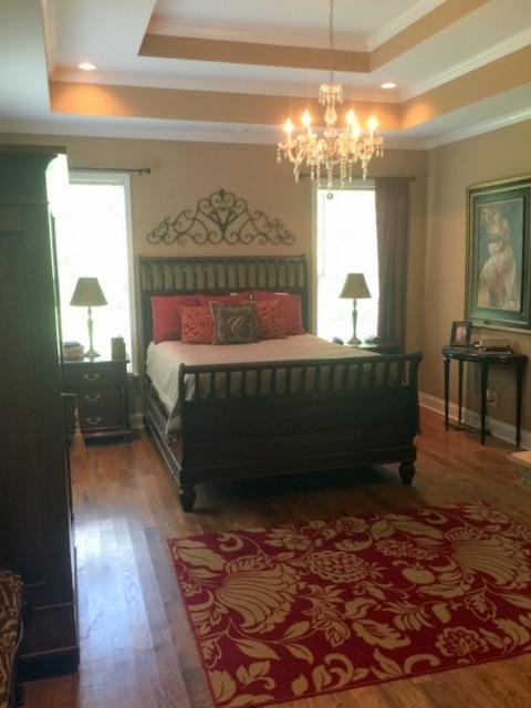 7813 Zebulon Road Macon, GA 31220 - Photo 14 of 21 a bed sitting in a bedroom next to a window
