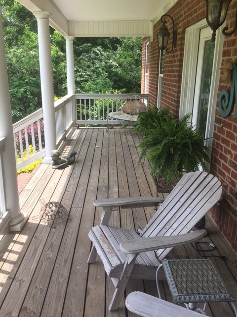 7813 Zebulon Road Macon, GA 31220 - Photo 17 of 21 a view of balcony with wooden floor and outdoor seating