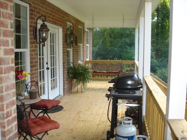 7813 Zebulon Road Macon, GA 31220 - Photo 19 of 21 a front view of a house with outdoor seating