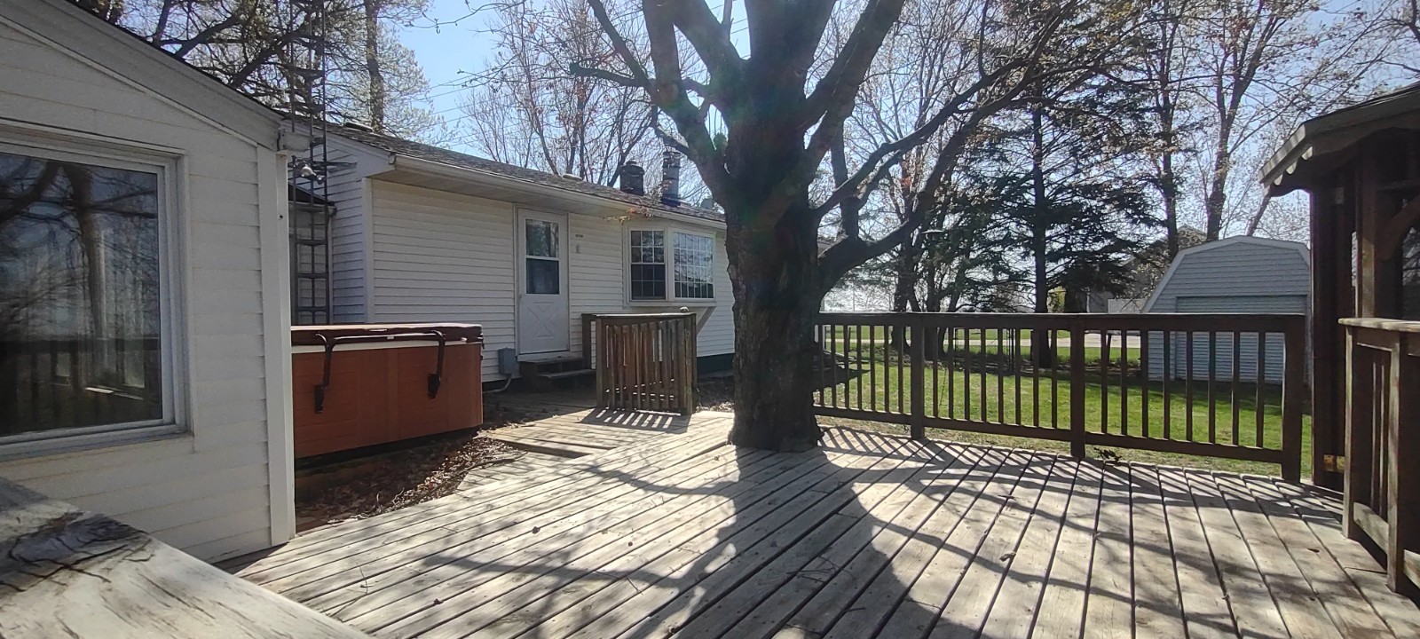 2 Holly Road Sterling, IL 61081 - Photo 3 of 19 a view of a balcony with a floor to ceiling window and wooden fence