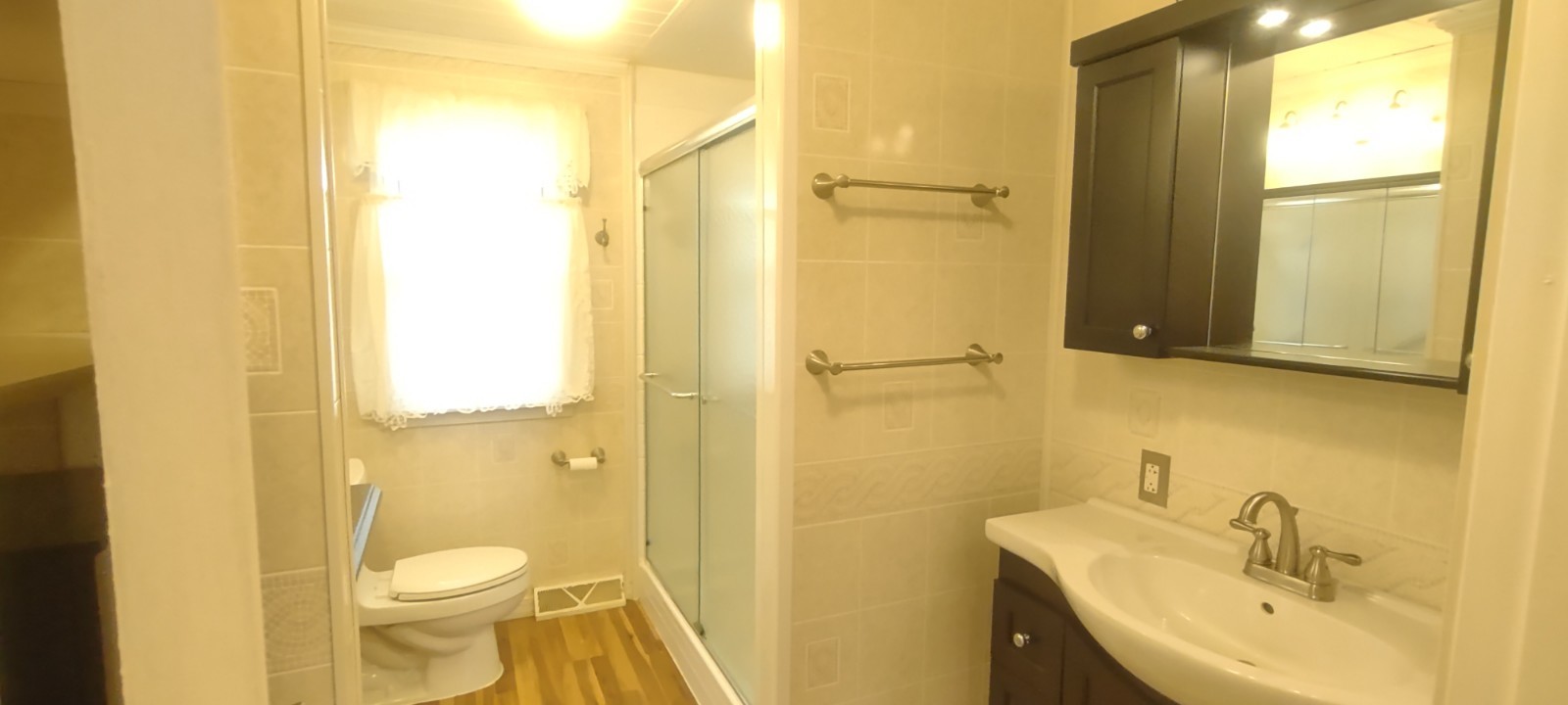 2 Holly Road Sterling, IL 61081 - Photo 10 of 19 a bathroom with a sink a toilet and shower