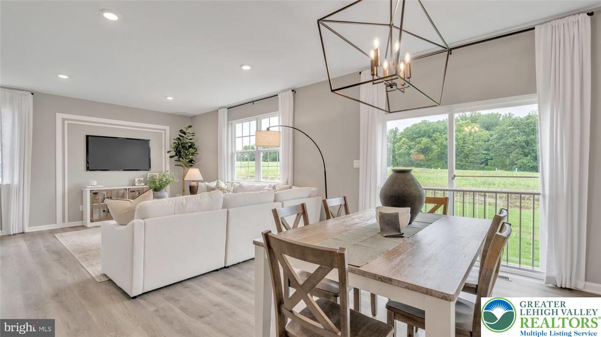 115 Winding Road Easton, PA 18040 - Photo 24 of 24 This living and dining area combination features an open floorplan with views of green expanses.