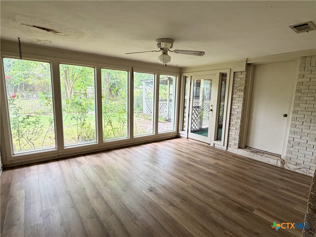 2711 Forest Trail Temple, TX 76502 - Photo 11 of 22 a view of an empty room with wooden floor and a window