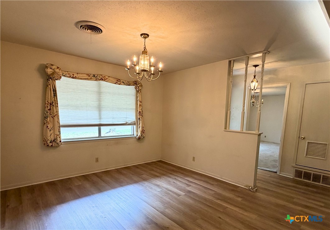 2711 Forest Trail Temple, TX 76502 - Photo 6 of 22 a view of empty room with wooden floor and fan