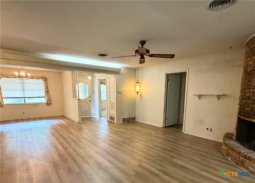 2711 Forest Trail Temple, TX 76502 - Photo 8 of 22 a view of an empty room with window and wooden floor
