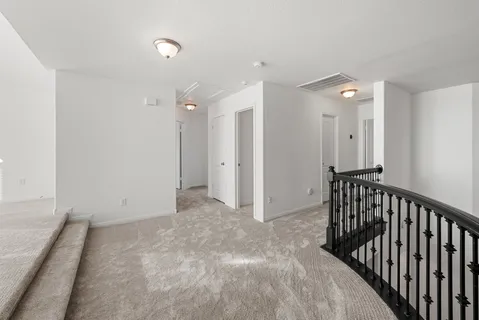 a view of a hallway with entryway and closet