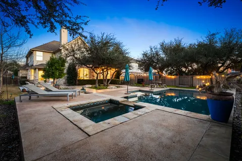 a view of a swimming pool with a patio