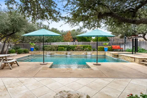 a swimming pool with outdoor seating