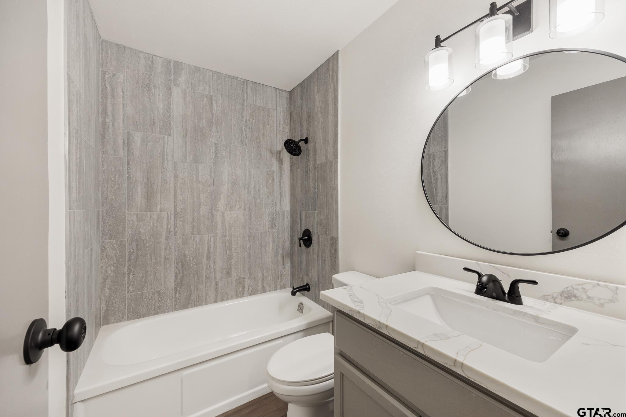 1538 North Hill Road Tyler, TX 75702 - Photo 20 of 29 a bathroom with a sink toilet and shower