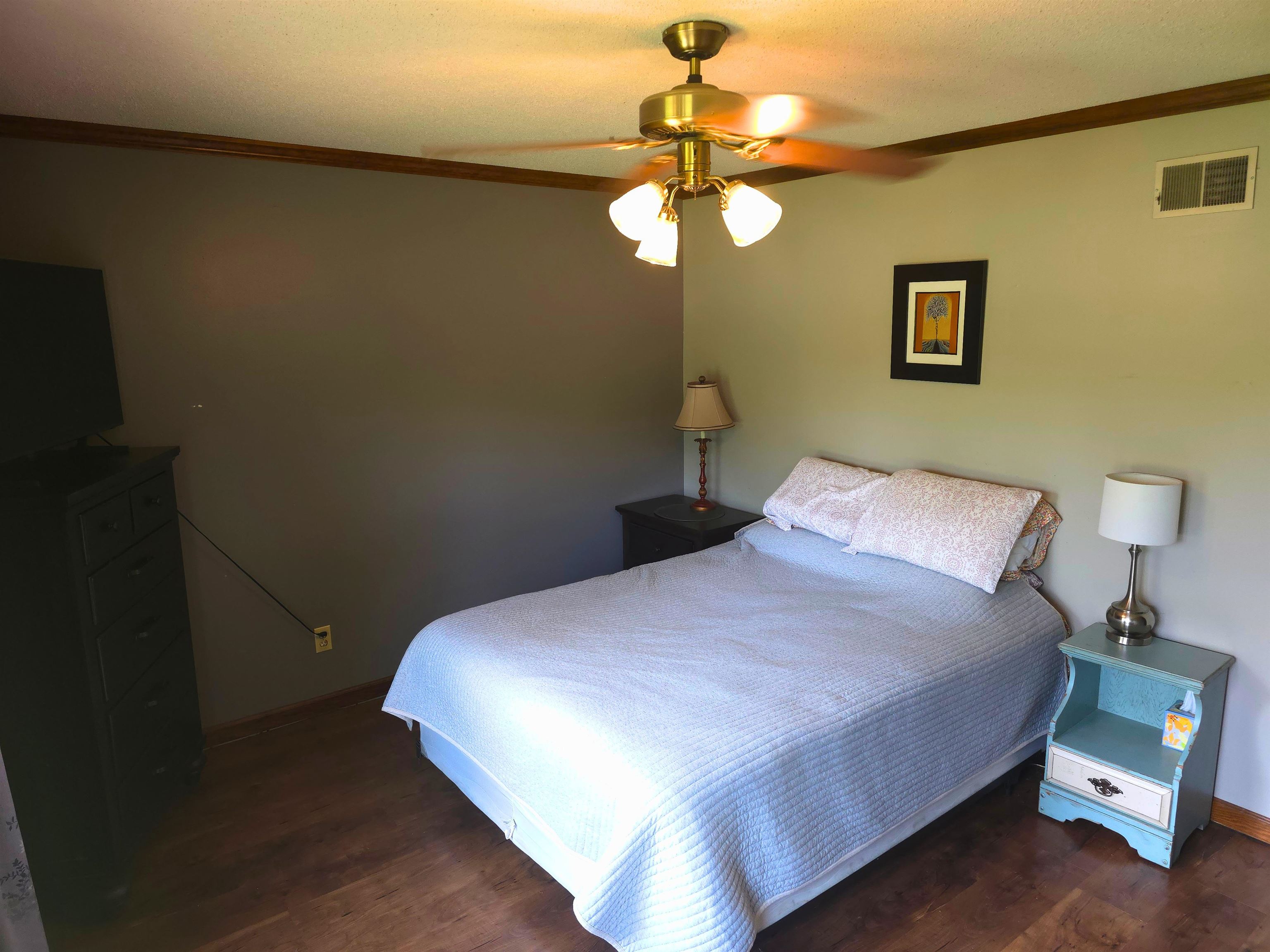 8724 Fay Road Memphis, TN 38018 - Photo 18 of 26 Bedroom featuring crown molding, ceiling fan, and dark wood-style flooring