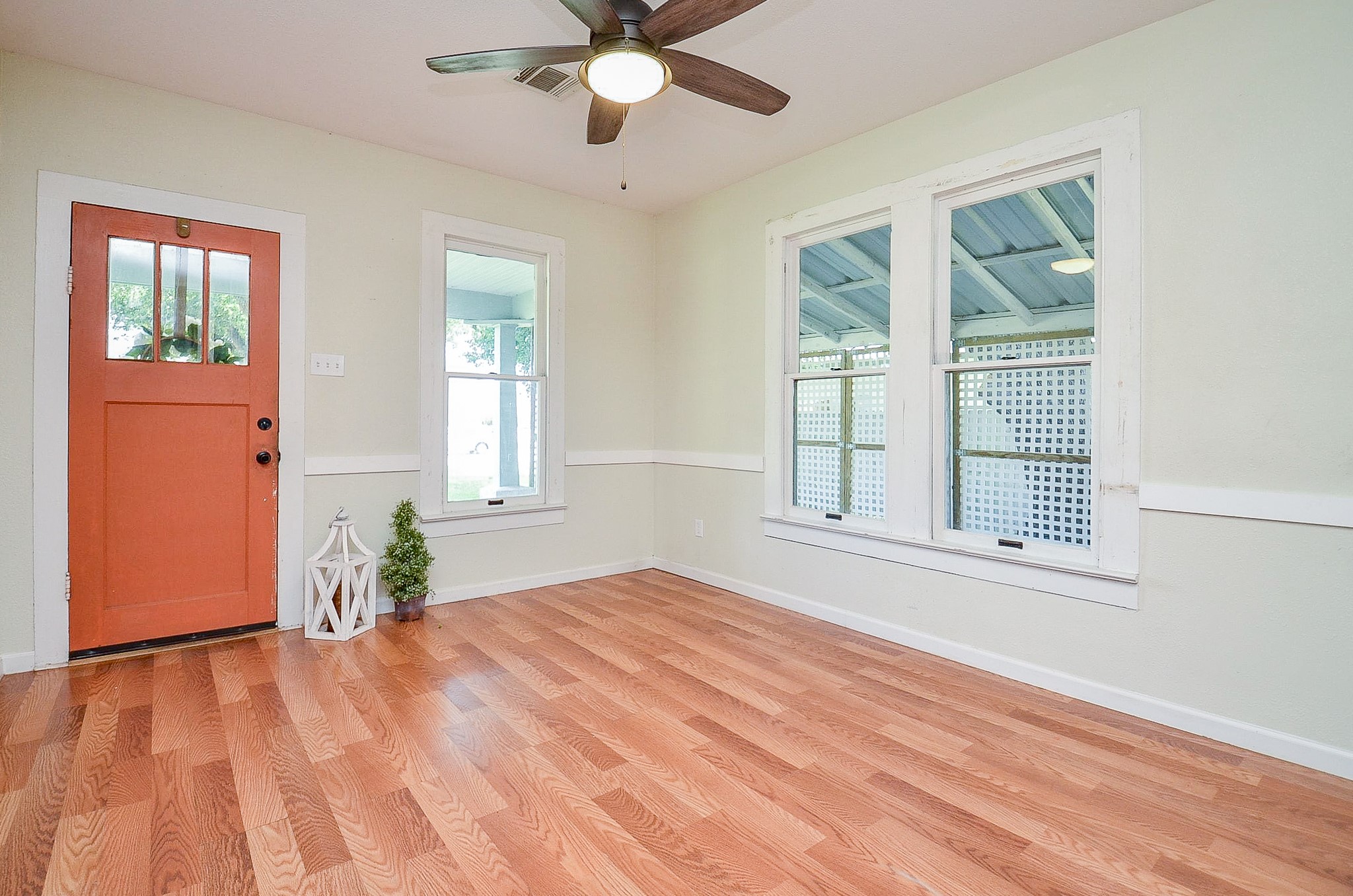 1615 Eagle Lake Road Sealy, TX 77474 - Photo 4 of 19 We love the architectural details in this home, from the pop of color on the front door, to the large windows with wood trim, and the accent chair rail trim too!