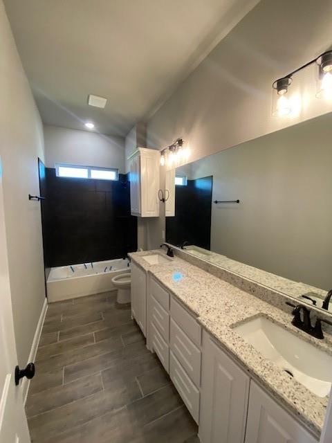 2001 Donna Court Azle, TX 76020 - Photo 19 of 20 a bathroom with a granite countertop sink a toilet and a bathtub