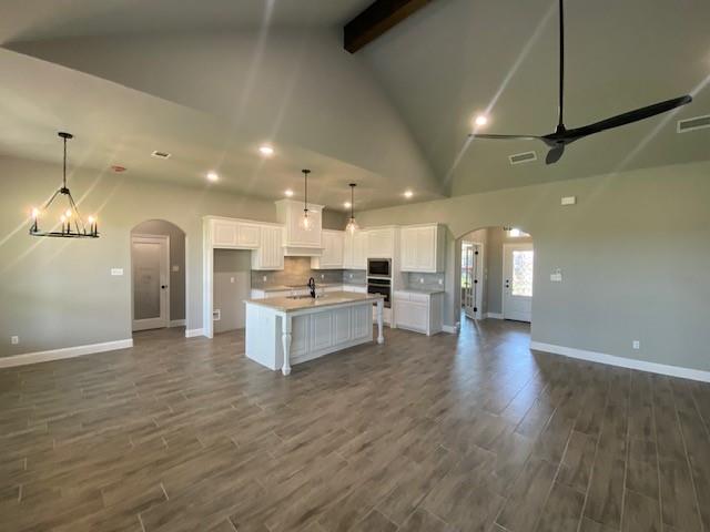 2001 Donna Court Azle, TX 76020 - Photo 7 of 20 a view of kitchen with kitchen island wooden floor center island and stainless steel appliances