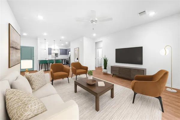 a living room with furniture and a flat screen tv