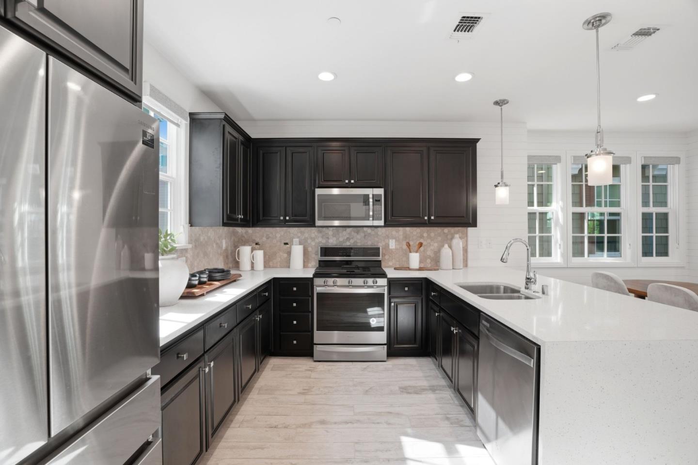 3806 Pyramid Way Mountain View, CA 94043 - Photo 15 of 44 a kitchen with stainless steel appliances granite countertop a sink stove and refrigerator