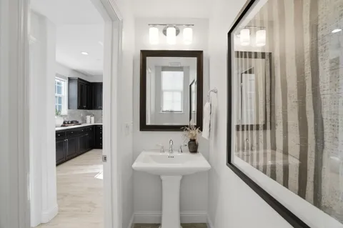 a bathroom with a sink double vanity and a mirror