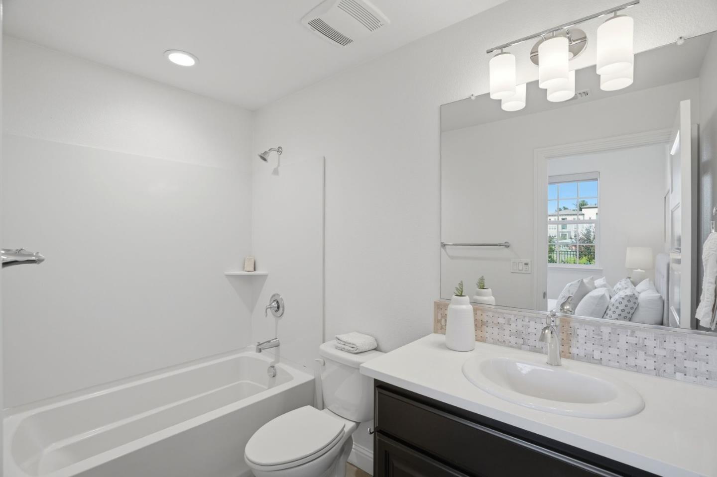 3806 Pyramid Way Mountain View, CA 94043 - Photo 20 of 44 a bathroom with a sink a toilet and shower
