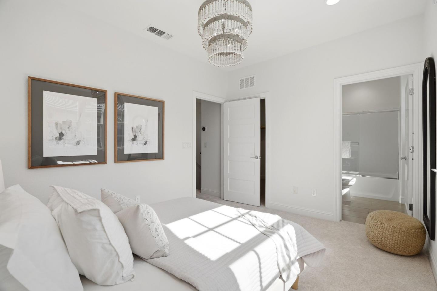 3806 Pyramid Way Mountain View, CA 94043 - Photo 23 of 44 a bedroom with a bed and a chandelier