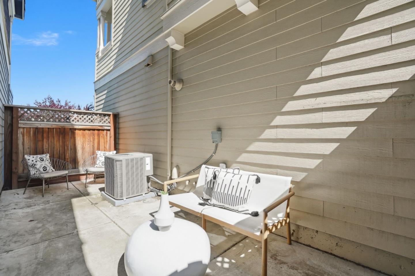 3806 Pyramid Way Mountain View, CA 94043 - Photo 33 of 44 a view of a patio with table and chairs and wooden floor
