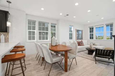 a dining room with a table and chairs