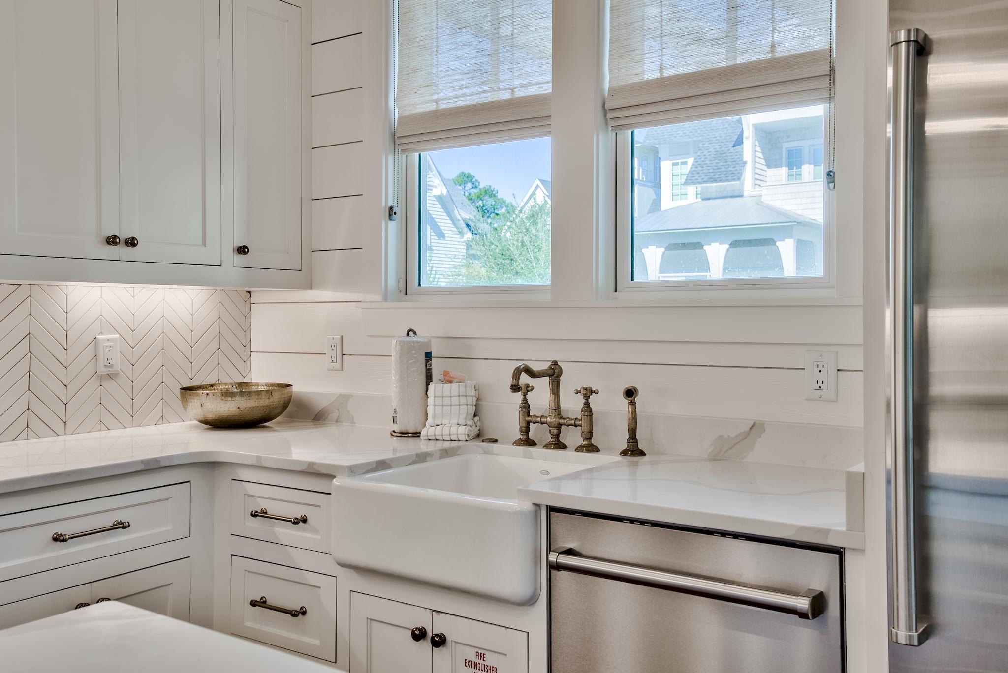 17 Patience Ln Inlet Beach Inlet Beach, FL 32461 - Photo 21 of 59 a kitchen with white cabinets and appliances
