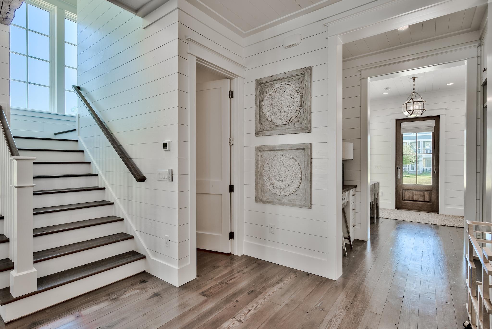 17 Patience Ln Inlet Beach Inlet Beach, FL 32461 - Photo 22 of 59 a view of a hallway with wooden floor and staircase