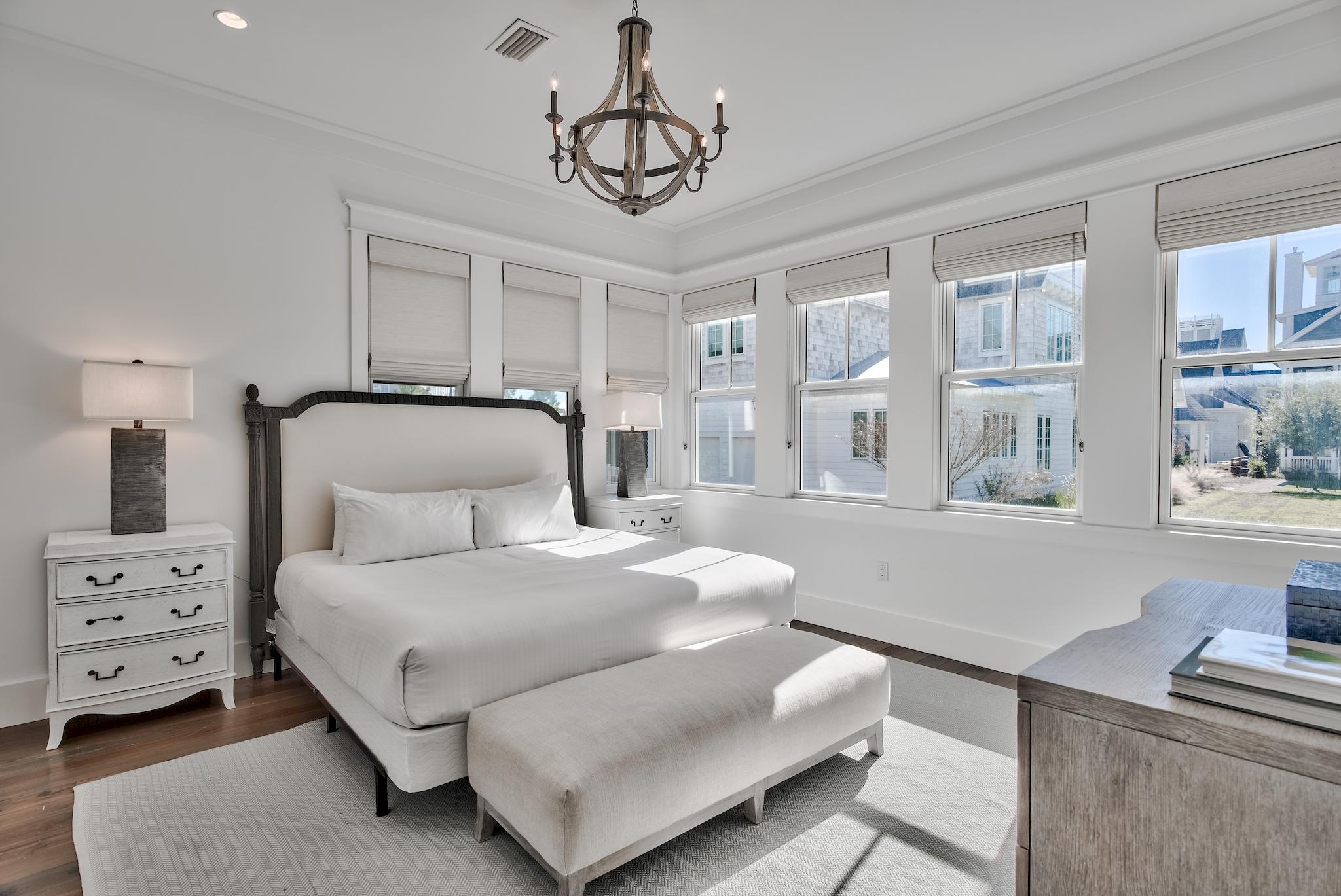 17 Patience Ln Inlet Beach Inlet Beach, FL 32461 - Photo 26 of 59 a bedroom with a bed and a chandelier