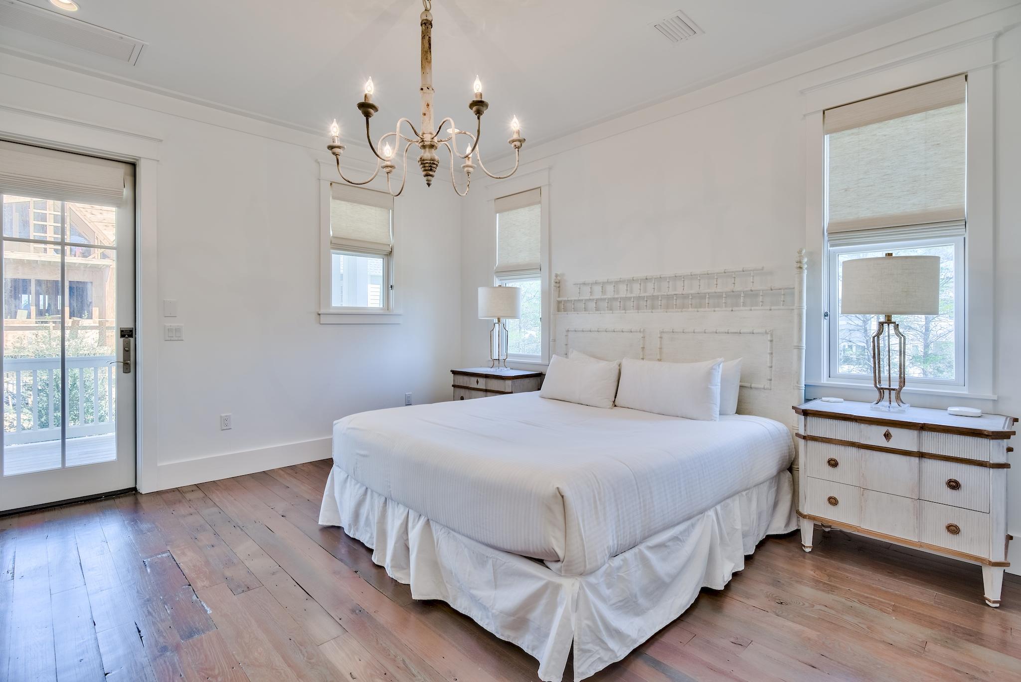 17 Patience Ln Inlet Beach Inlet Beach, FL 32461 - Photo 32 of 59 a bedroom with a large bed and a chandelier