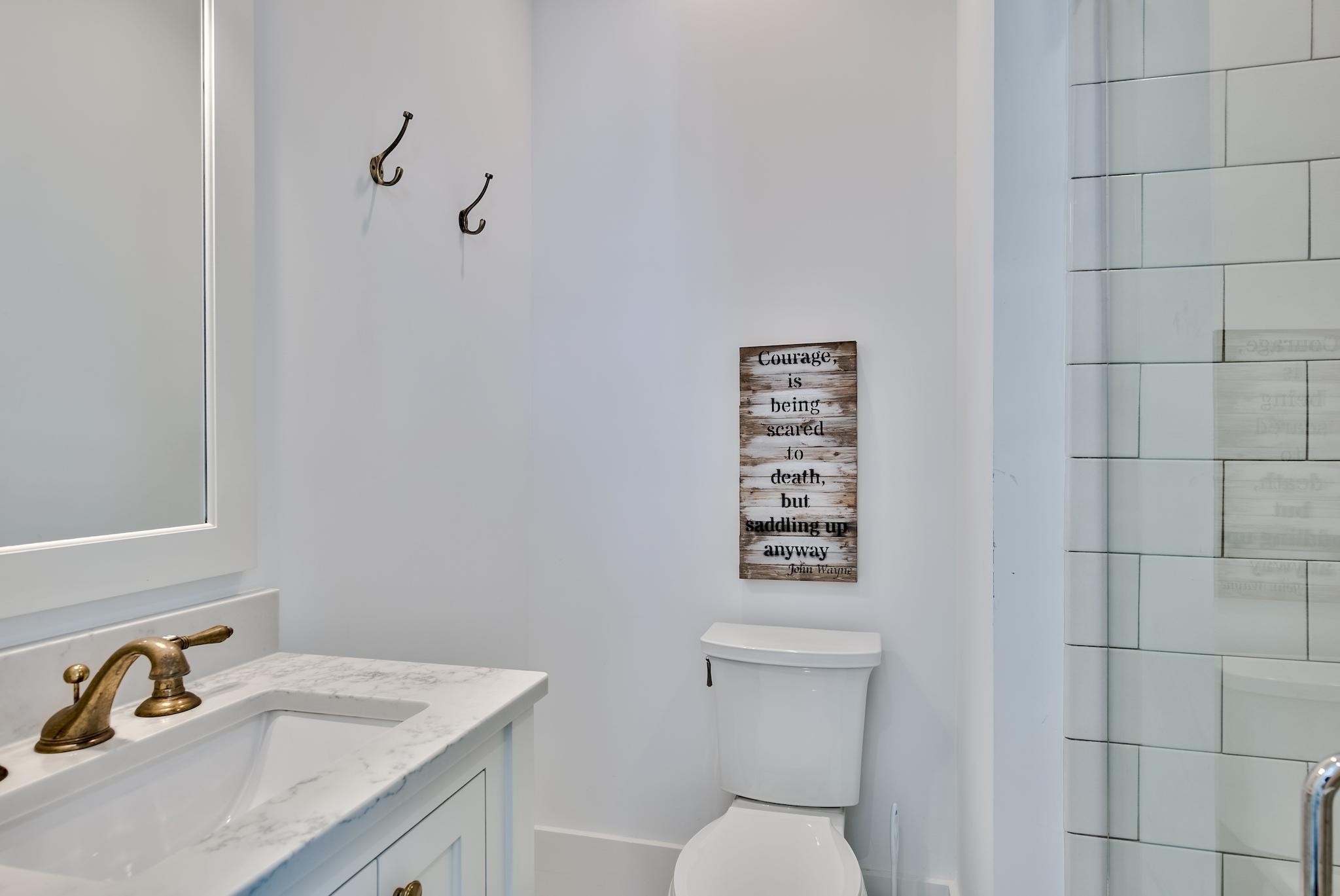 17 Patience Ln Inlet Beach Inlet Beach, FL 32461 - Photo 38 of 59 a bathroom with a toilet sink and mirror