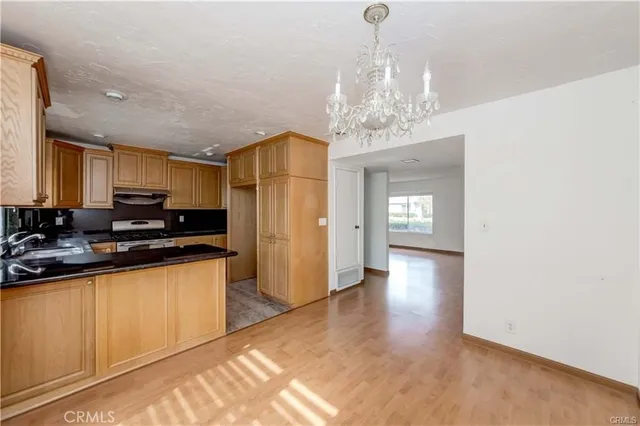 a view of a kitchen with electric appliances