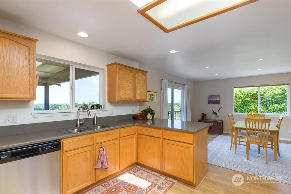 41 Onyx Lane Sequim, WA 98382 - Photo 18 of 40 a large kitchen with a large window and cabinets