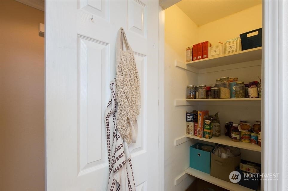 41 Onyx Lane Sequim, WA 98382 - Photo 19 of 40 a room with a book shelf and a shower curtain