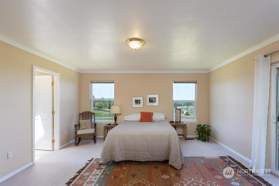 41 Onyx Lane Sequim, WA 98382 - Photo 20 of 40 a bedroom with a bed and a couch
