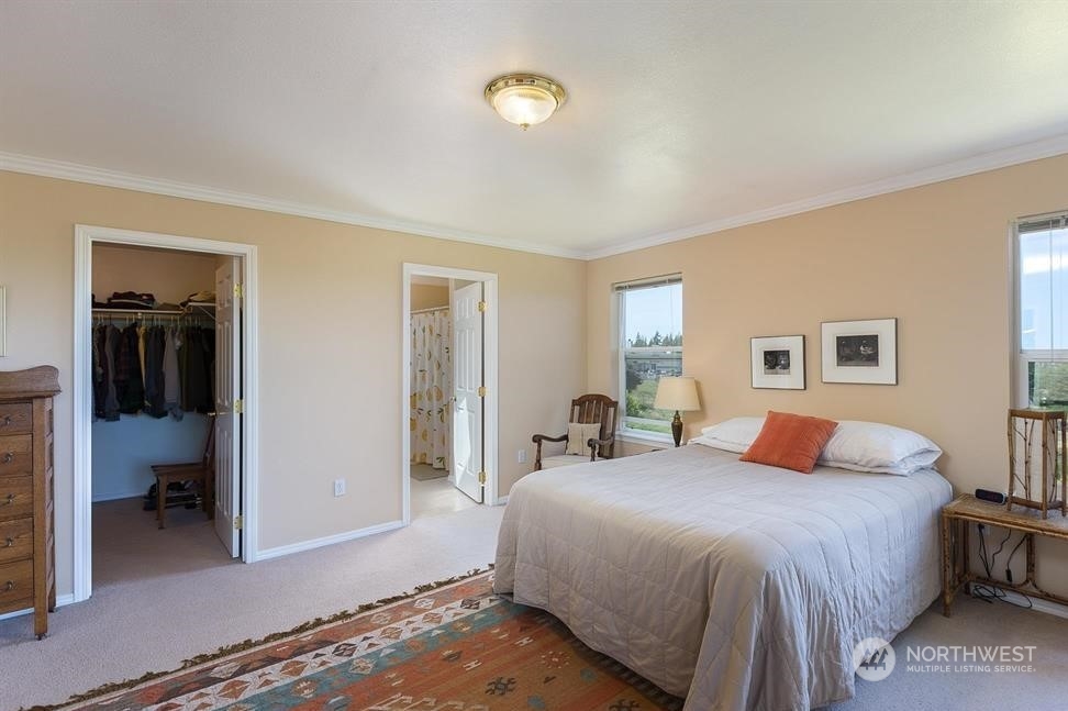 41 Onyx Lane Sequim, WA 98382 - Photo 21 of 40 a bedroom with a bed and a walk in closet
