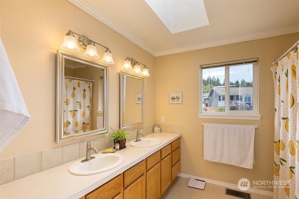 41 Onyx Lane Sequim, WA 98382 - Photo 23 of 40 a bathroom with a sink and a mirror
