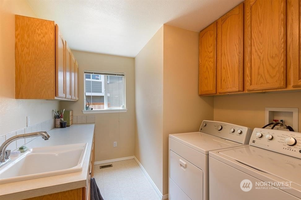41 Onyx Lane Sequim, WA 98382 - Photo 30 of 40 a utility room with dryer and washer
