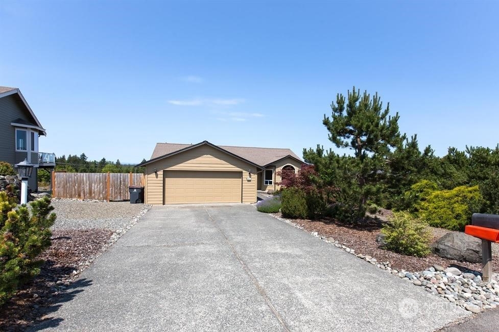 41 Onyx Lane Sequim, WA 98382 - Photo 3 of 40 a view of house with a yard and potted plants