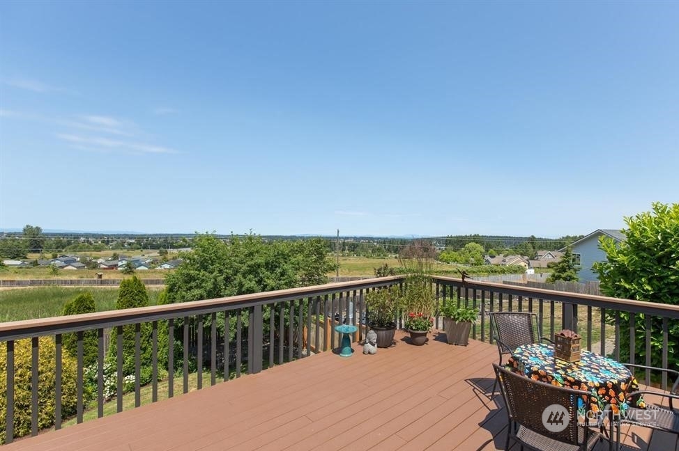 41 Onyx Lane Sequim, WA 98382 - Photo 35 of 40 a view of a balcony with wooden chairs
