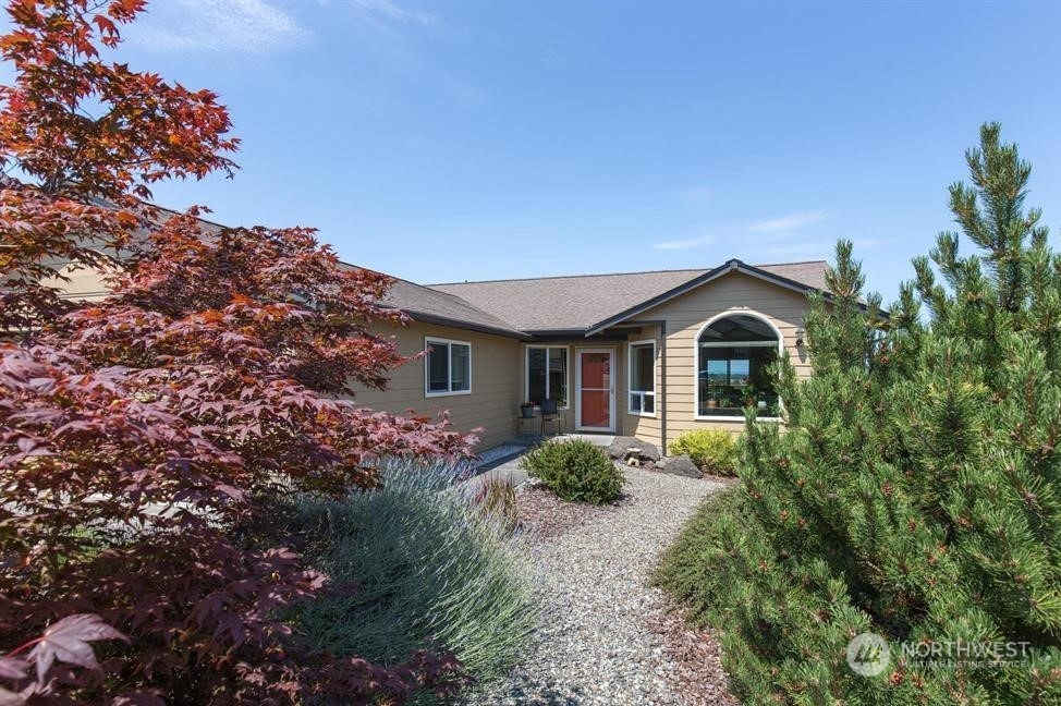 41 Onyx Lane Sequim, WA 98382 - Photo 5 of 40 a front view of a house with garden