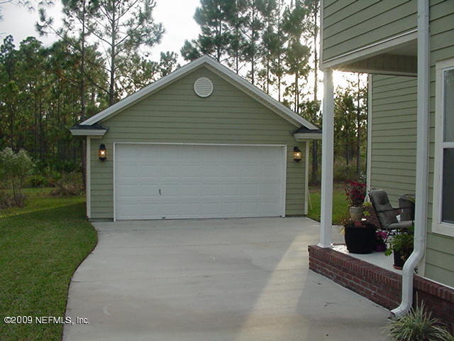 3715 Chasing Falls Road Orange Park, FL 32065 - Photo 28 of 33 View of garage and back porch
