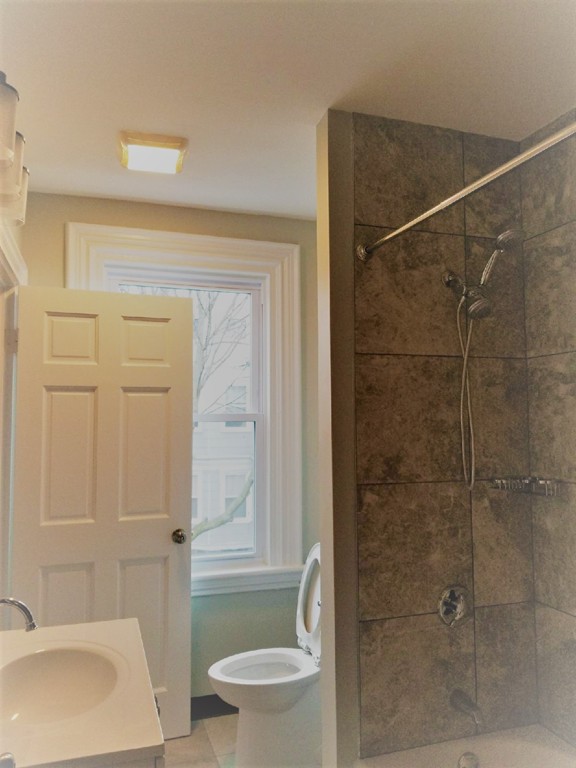 40 Humphreys Street Boston, MA 02125 - Photo 13 of 13 a bathroom with a sink and toilet
