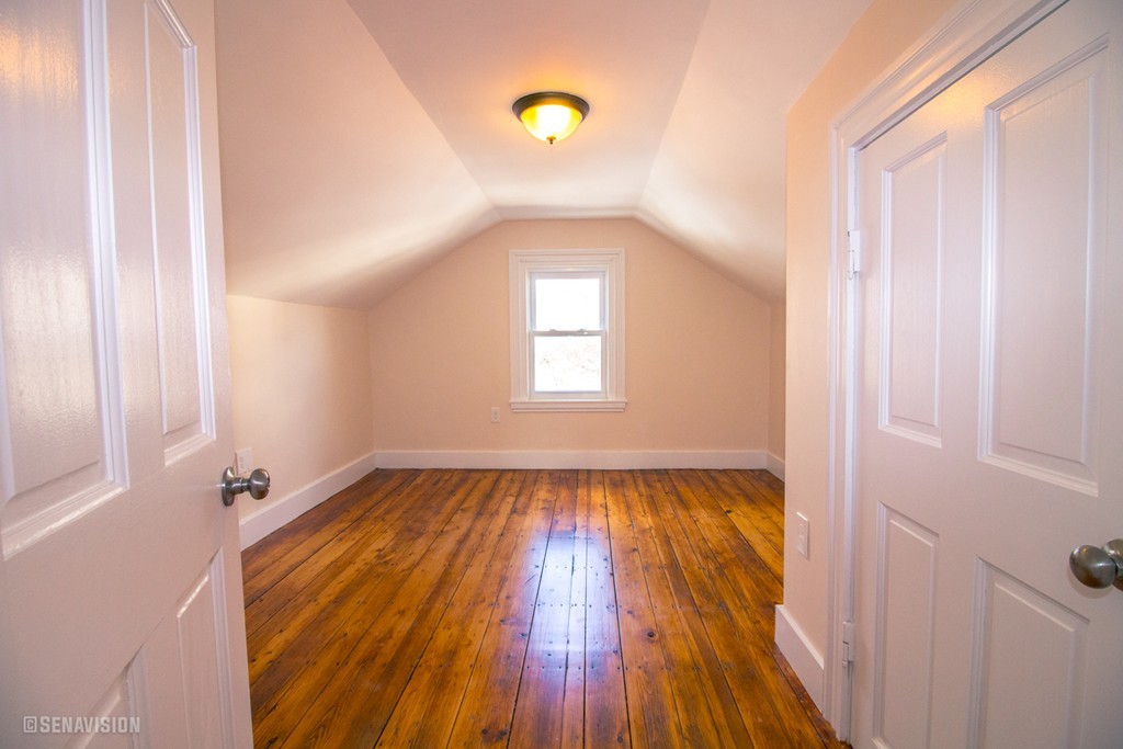 40 Humphreys Street Boston, MA 02125 - Photo 5 of 13 a view of a room with wooden floor and window