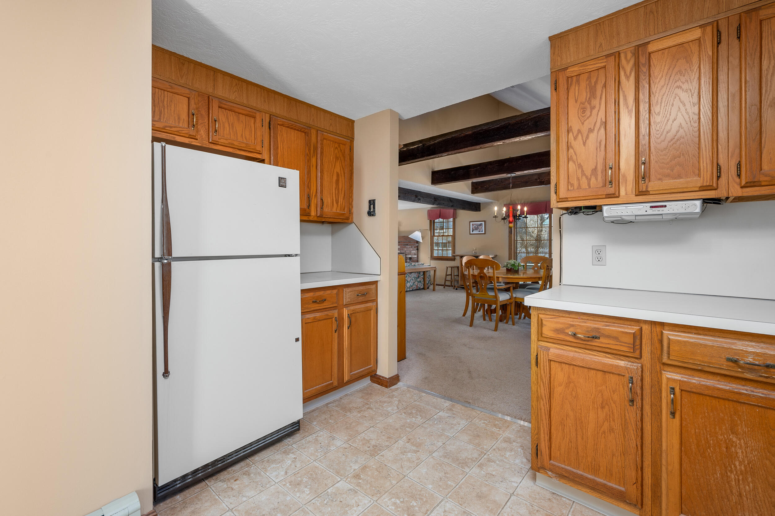 4 Ralyn Road Cotuit, MA 02635 - Photo 11 of 53 a view of storage and utility room with refrigerator and dishwasher