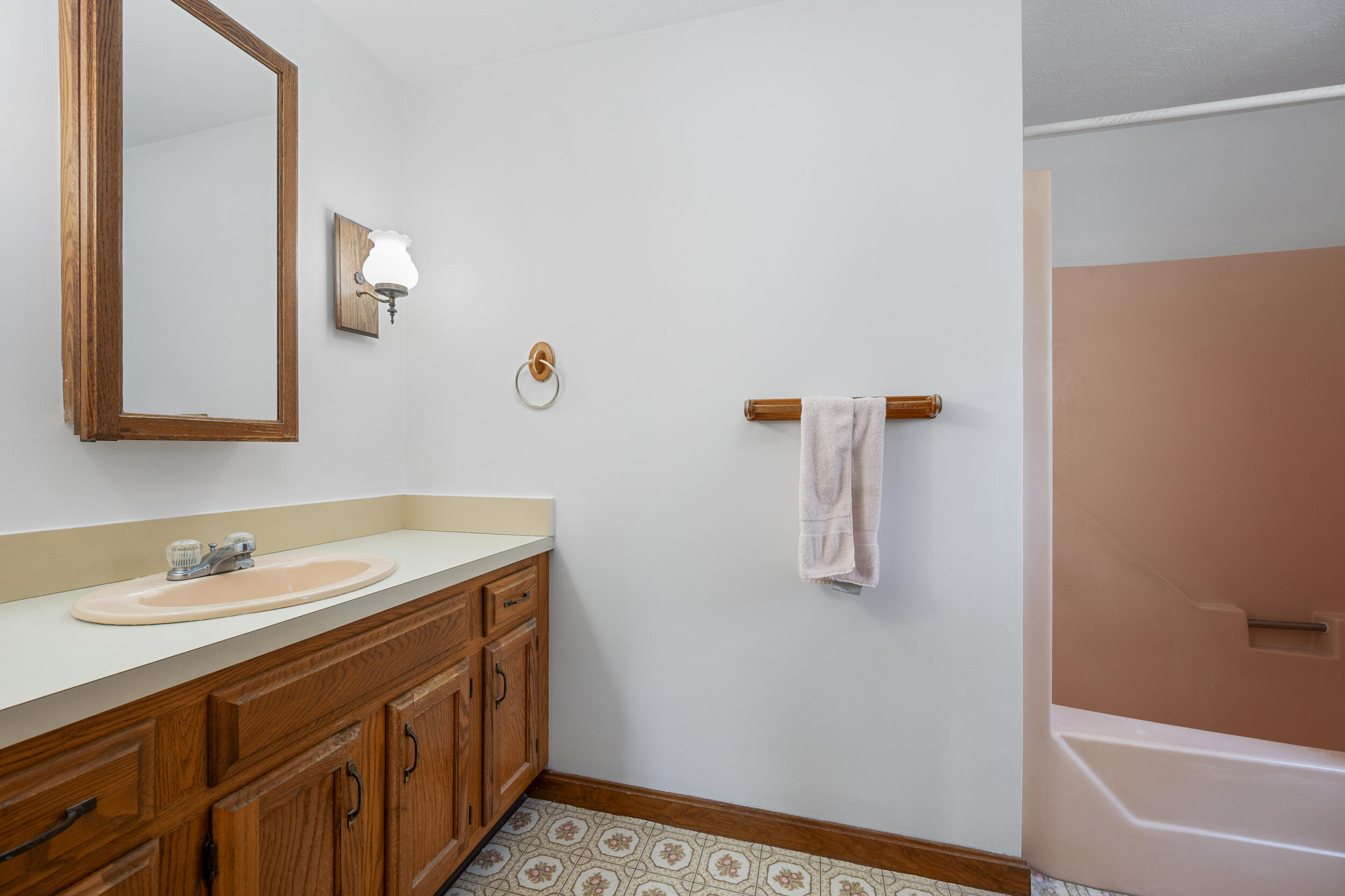 4 Ralyn Road Cotuit, MA 02635 - Photo 17 of 53 a bathroom with a sink and mirror