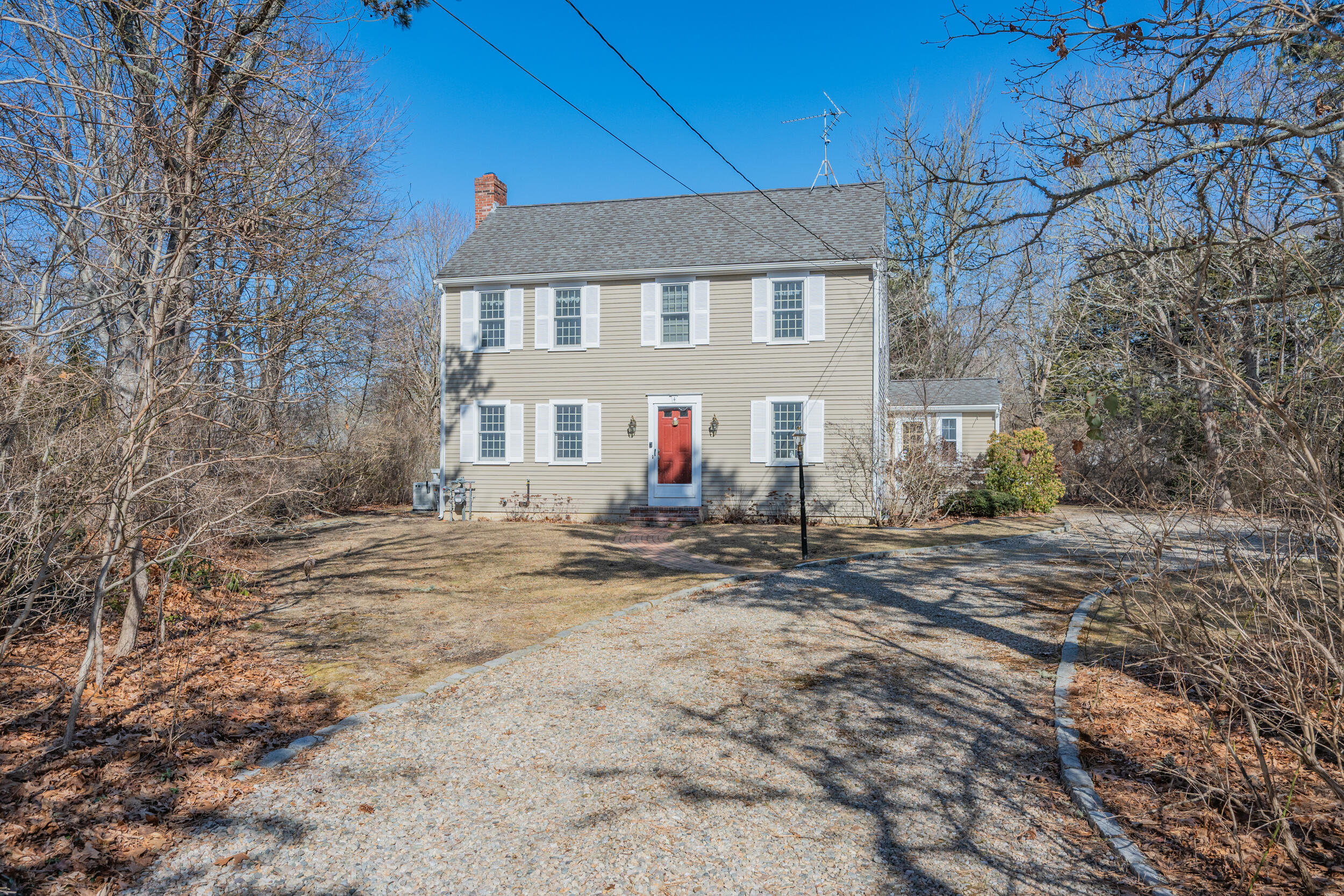 4 Ralyn Road Cotuit, MA 02635 - Photo 36 of 53 a front view of a house with large trees